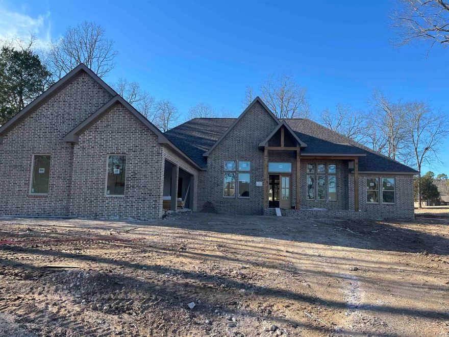 New Construction Isabella Golf Course Experience refined golf-course living in this new construction contemporary home ideally positioned on a level lot along the Isabella Golf Course in Hot Springs Village. Designed with both style and function in mind, this residence offers sweeping golf course views and a seamless indoor–outdoor connection. High-end finishes and attention to details define the upscale aesthetic, while thoughtfully designed living spaces provide comfort and flexibility for everyday living or entertaining. Expansive windows frame fairway views and flood the home with natural light, enhancing the open-concept layout. The kitchen features premium materials, custom cabinetry, and upscale fixtures, complementing the home’s upscale design. Quality craftsmanship is evident throughout, from the curated finishes to the efficient floor plan that maximizes the level setting and golf-front location. Enjoy the tranquility of golf-course living with the convenience and amenities of Hot Springs Village, including multiple golf courses, lakes, trails.  Taxes are based on unimproved lot, consult the county assessor for taxes with home constructed.