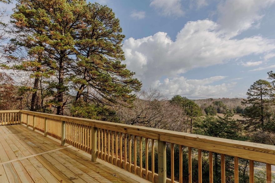 SELLER IS OFFERING $5,000 BUYER CREDIT AT CLOSING WITH ACCEPTABLE OFFER. NEW ROOF 9/2025. NEW PORCH COMPLETED 10/2025. This home is perfect for multi-generational living and sits on 5 acres, where wildlife roams plus amazing views from the wraparound porches! There’s also a shop with electricity and an old farmhouse on the property that could be fixed up or torn down—your choice. The 5 acres sits on an upslope, which provides the wonderful views from the porches!  On the main floor, you'll find 2 bedrooms, 1 bathroom, an updated kitchen, an office, a living room, and a laundry room (which could easily be turned into a 3rd bedroom). Total main floor square footage is 1,630. The basement adds another 980 sq/ft of finished space and includes a living room, bedroom, bathroom, laundry area, and even a bar! Both levels have French doors that open to the outside, making it easy to enjoy the peaceful surroundings.  Recent updates include a brand new HVAC system, new furnace, a freshly remodeled kitchen, dehumidifier and complete remodel of the basement. Fiber internet is available through Connect2First, so you're all set for remote work or streaming.