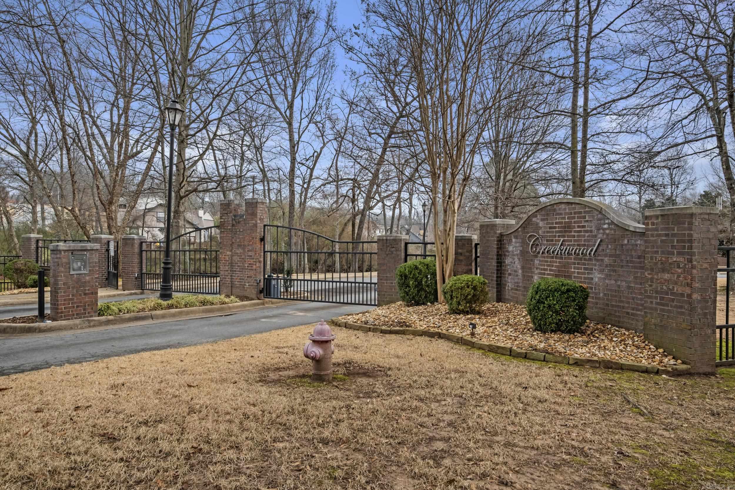 Nestled in a Serene, gated community this stunning home offers the perfect blend of luxury, comfort and natural beauty. Set beside a picturesque creek, the property provides a peaceful setting where you can unwind to the soothing sounds of water, and enjoy visits from local wildlife and birds. Inside, a dedicated Media Room awaits, complete with theater seating and newer surround sound equipment.The Heart of the Home is a chef's dream kitchen boasting top of the line appliances, elegant Brookhaven cherry wood cabinetry & quartz counters. The primary suite is a a private oasis with a handicap accessible bath with heated floors, a smart privacy window, luxurious steam shower & a custom walk-in closet. Additional features include a walk-in attic, 2 extra large BR's & Baths and a great laundry room. Whether you are enjoying a quiet morning by the creek, entertaining in the media room or preparing meals in the gourmet kitchen, this home delivers. see agent remarks