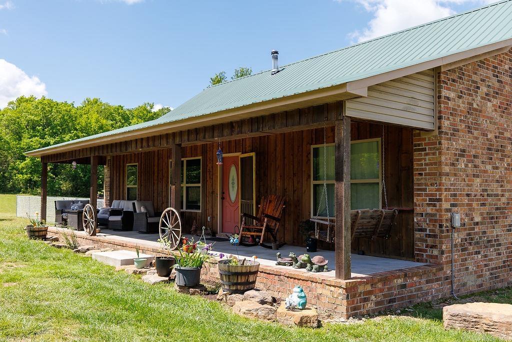 Come see this charming 1,884 sq ft home that sits on a 4 acres, offering a peaceful rural setting with scenic views. This home features stained concrete flooring. Tongue & groove vaulted ceilings. Custom pine cabinetry. Wood burning fireplace. Covered front porch and deck. Fenced yard for pets. But wait, there's more. A new shop 30x55 rural living at its best, live life here!
