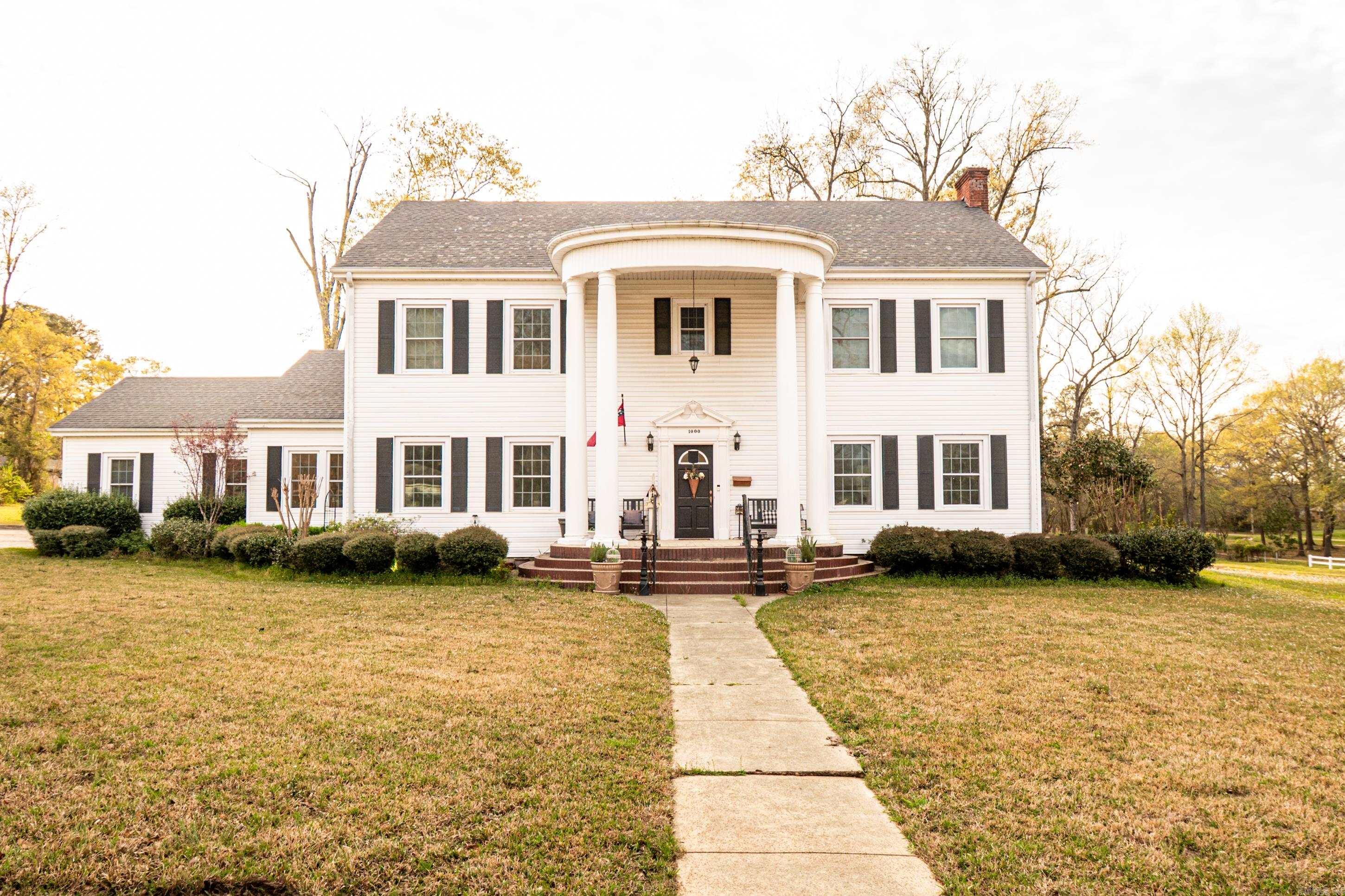 Stunning 1933 Colonial on 3.51 Acres – 1000 S. Broadway Step into timeless elegance with this breathtaking 1933 Colonial home, perfectly situated on 3.51 acres. Offering 4,621 sq. ft. of beautifully maintained living space across three floors, this 5-bedroom, 3-bath home is a rare find. The thoughtfully updated kitchen is a chef’s dream, featuring a large island, butler’s pantry, commercial refrigerator, large gas range with pot filler, and an appliance cabinet. Enjoy multiple living spaces, including a formal living room, office, and cozy den with a wood-burning fireplace. The third floor offers incredible versatility—it can serve as a spacious bedroom or an expansive game room. Outdoors, you'll find a large shop, additional covered parking, a charming gazebo, and a covered back porch ideal for entertaining. Located near the park and scenic walking trails, this home truly has it all! Don’t miss your chance to own this one-of-a-kind property! Contact us today for a showing.