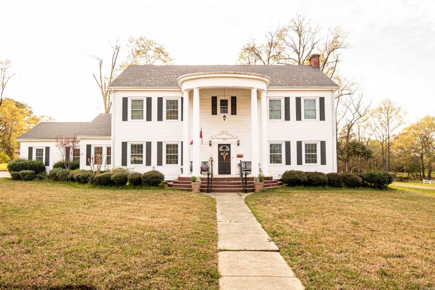 Stunning 1933 Colonial on 3.51 Acres – 1000 S. Broadway  Step into timeless elegance with this breathtaking 1933 Colonial home, perfectly situated on 3.51 acres. Offering 4,621 sq. ft. of beautifully maintained living space across three floors, this 5-bedroom, 3-bath home is a rare find. The thoughtfully updated kitchen is a chef’s dream, featuring a large island, butler’s pantry, commercial refrigerator, large gas range with pot filler, and an appliance cabinet.  Enjoy multiple living spaces, including a formal living room, office, and cozy den with a wood-burning fireplace. The third floor offers incredible versatility—it can serve as a spacious bedroom or an expansive game room. Outdoors, you'll find a large shop, additional covered parking, a charming gazebo, and a covered back porch ideal for entertaining. Located near the park and scenic walking trails, this home truly has it all!  Don’t miss your chance to own this one-of-a-kind property! Contact us today for a showing.