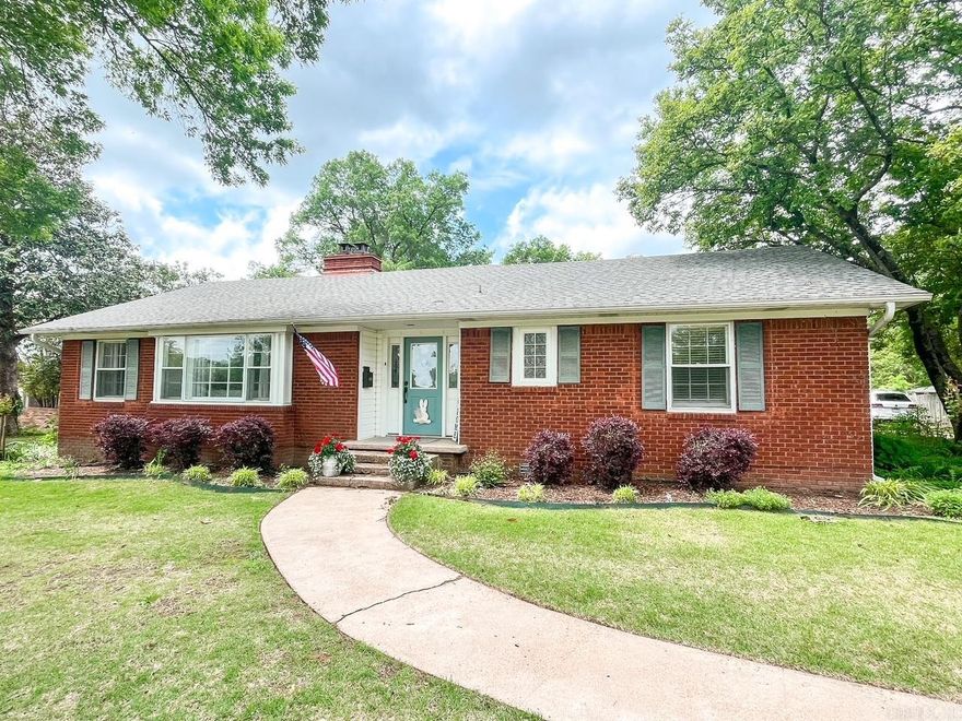 This stunning, well-built home located on a nearly half acre lot has so much charm. You will feel right at home when you step in the door with all original wood floors in the living room, hallway and bedrooms. There are some lovely built-ins, wooden walls, a gorgeous rock fireplace, and a spacious dining room right off the kitchen with windows all around! The original house is a 3/2, but a second primary bedroom & bath were added including a spacious walk-in closet. Updates within the last 5 years include, new roof, furnace, water heater, & gutters. The kitchen features granite counters, updated fixtures, breakfast bar and a great view out the picture windows. Organization is a cinch as this home has great closets throughout as well as a nice pantry area! The back yard is fenced & there is a storage building as well! So much to offer for the price!  Agents please see remarks for showing instructions!