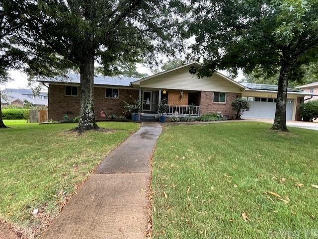 All brick home in established Lake Hamilton subd. This 3/2 home has been WELL maintained and seller has updated top to bottom! The garage is heated and cooled as well as the "man cave" below the home. HVAC, mini split, and new windows in 2025. Updates since 2020 include generator, appliances, fixtures, water heater, garage door opener, paint, LVP flooring. 2023 new ROOF, new gutters w Leaf Filter , and solar panels for great savings on utilities! Dryer and range can be gas or electric. When weather permits, open the windows and enjoy the attic fan. Cul de sac location has water views. Private boat ramp for residents use. Deck and firepit in the well maintained back yard to enjoy outdoors and lake life. Sprinkler waters from lake. Entire subd is well maintained...you will love calling it "HOME"... AND it's SO CLOSE to shopping, restaurants, hospital, and OAKLAWN CASINO RESORT too!