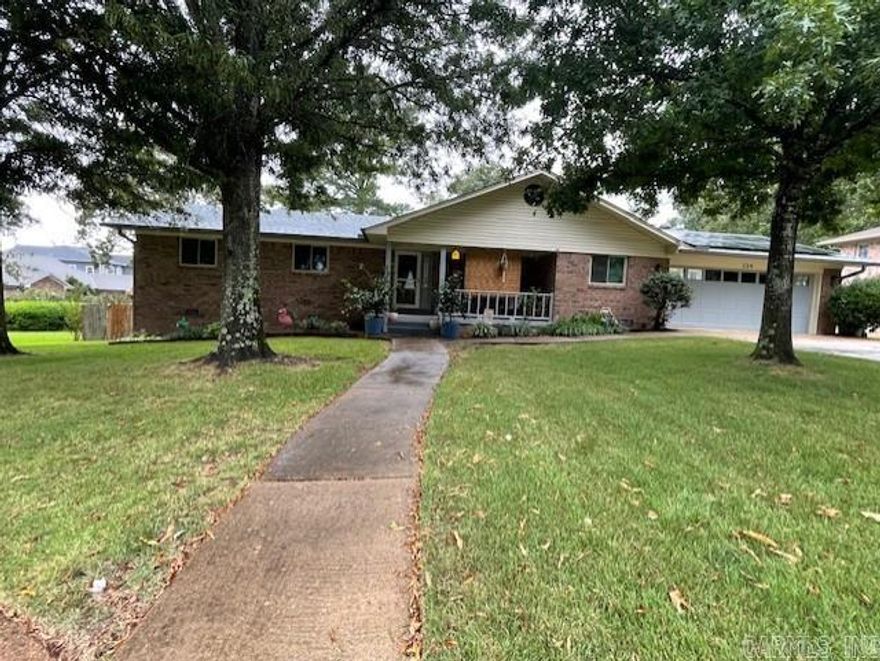 All brick home in established Lake Hamilton subd. This 3/2  home has been WELL maintained and seller has updated top to bottom! The garage is heated and cooled as well as the "man cave" below the home. HVAC, mini split, and new windows in 2025. Updates since 2020 include generator, appliances, fixtures, water heater, garage door opener, paint, LVP flooring. 2023 new ROOF, new gutters w Leaf Filter , and solar panels for great savings on utilities! Dryer and range can be gas or electric. When weather permits, open the windows and enjoy the attic fan. Cul de sac location has water views. Private boat ramp for residents use. Deck and firepit in the well maintained back yard to enjoy outdoors and lake life. Sprinkler waters from lake. Entire subd is well maintained...you will love calling it "HOME"...  AND it's SO CLOSE to shopping, restaurants, hospital, and OAKLAWN CASINO RESORT too!