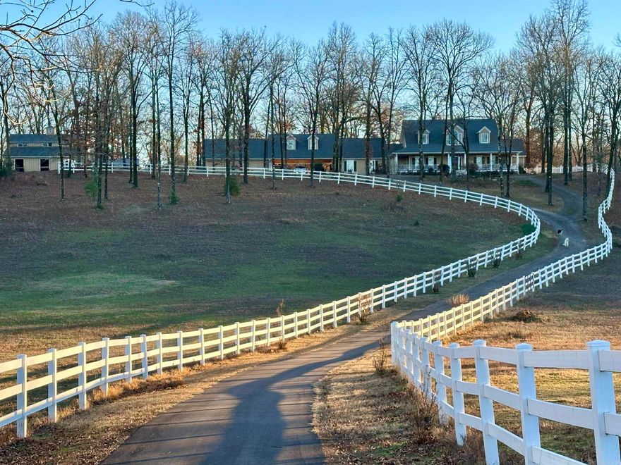 20+ FENCED ACRES, A LOVELY HOME, POOL, SHOP, BARN AND RECREATION ROOM - all less than 10 Minutes to city limits!  The driveway to this property is 1/2 mile long in an extremely private setting!  Come and enjoy the view from the wrap around porches and watch wildlife, horses and evening sunsets!  Interior of the main home offers a large Living Area with crafted millwork, Anderson windows for views of the Pool in the summer and for the Winter - a cozy fireplace.  Other features include hardwood & tile flooring throughout, separate formal and casual Dining, Office/Piano Room, large main level Master Suite, and a great Kitchen and Laundry area. Included with the main home is a separate 1 Bedroom, handicap accessible Apartment with it's own entrance, kitchenette, bath and WI closet! There is also the 850 SF Rec Room - which has its own heat/air, hardwood flooring and can be used for multiple purposes - Pickle Ball, Dance, Family Gatherings, etc.  Beyond the Rec Room is a large shop with 12' overhead doors and a 5 stall horse barn w/ Loft and Tac room.