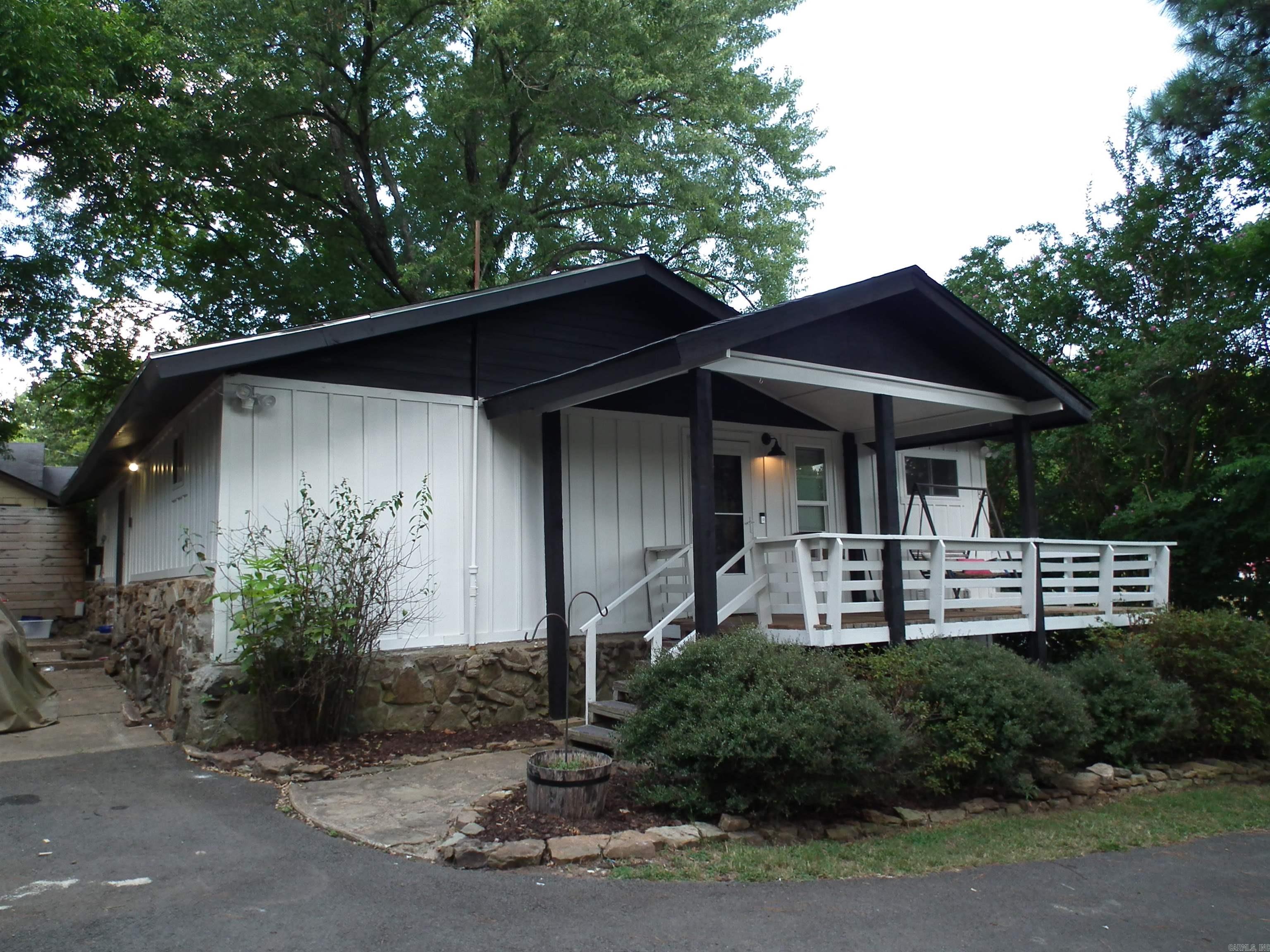 Nestled under beautiful shade trees, sits a newly remodeled cottage that is looking for a new owner. 3 bedrooms/2baths. Shiplap walls give a vintage feel. New in 2022-appliances & flooring. New in 2023-thermal windows, water heater, roof, updated plumbing (both baths) and updated electrical panel. Storm cellar, storage building/garage/office. Must see to really appreciate how very cute and functional this precious house is.