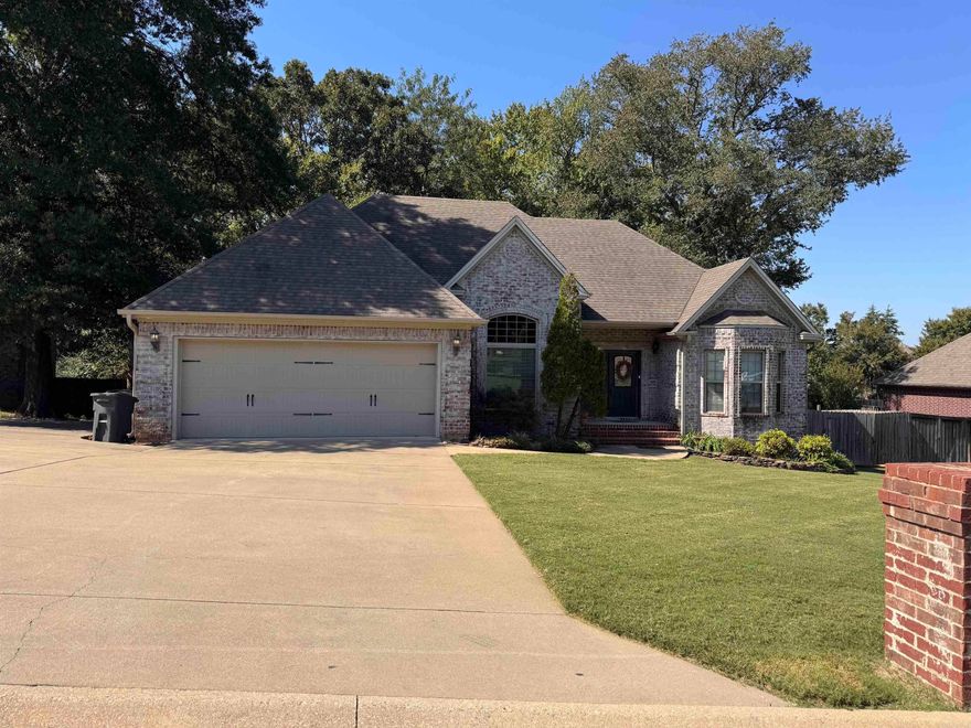 The well maintained home sits on a quiet street in Saddlebrook Estates, with a large almost half acre lot including some wooded area behind. The front entry has a barrel ceiling with brick detailing, and opens to a large living area with corner fireplace with gas logs. The dining room has a triple-tray tall ceiling and large front window. A large central kitchen features stained cabinetry and breakfast bar area great for gatherings. Refrigerator included. The owners suite is large and includes a huge double sink vanity, jetted tub, separate tile shower, and large closet space. Enjoy time on this lovely back deck with lots of trees and view of your fenced backyard below.