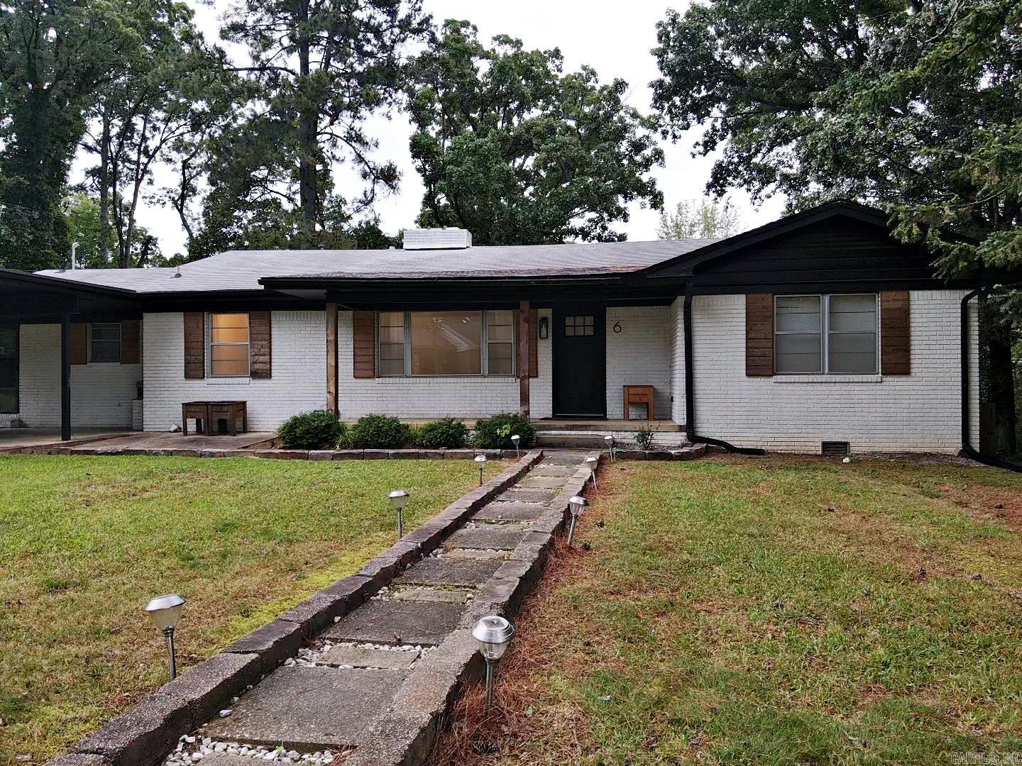 Beautifully remodeled home. Featuring spacious indoor and outdoor living. 4 bedrooms on the main level with 3 bathrooms, 2 living room areas, large kitchen and dining. Then step into a fabulous basement with 2 large rooms that can be used for bedrooms or any other type of entertainment space. Plus a walkout patio with large fenced in back oasis. Storage space that is unbelievable and access to this property from 10th Street. Come check it out today!