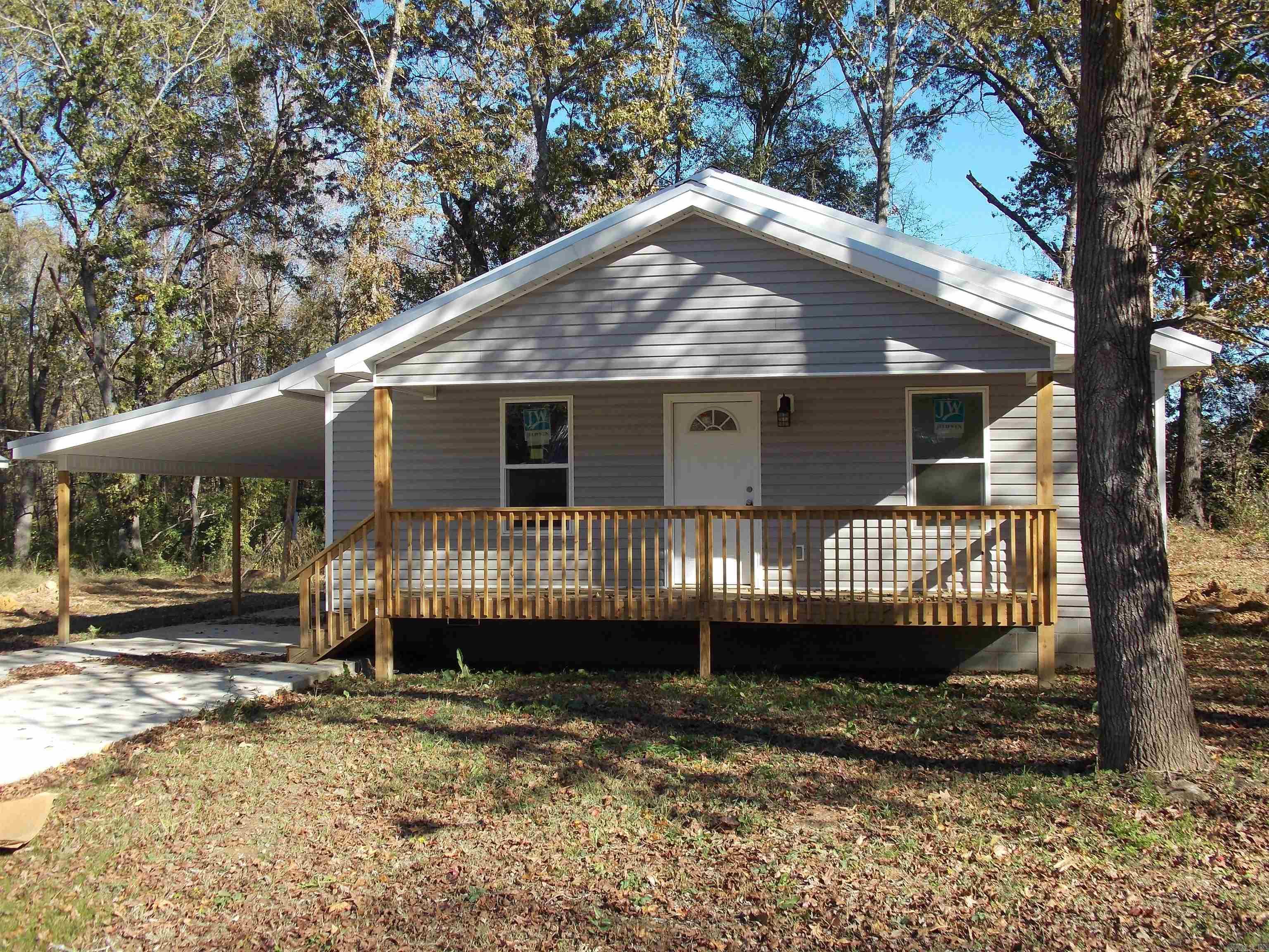 Cute cottage style house with good use of floor plan. Open floor plan, kitchen, dining and living room open space, nice pantry, luxury vinyl plank flooring, metal roof, sep laundry area, carport with nice larger storage area with double doors for easy access, could be work shop. Buyer can pick wall paint color at this point. Lot size is estimate. Square footage from house plans.