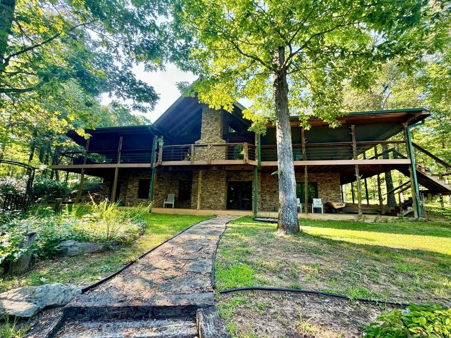 Property offers a perfect blend of luxury, comfort, & functionality spread over 40 acres w/a wet weather creek on the back side of the property. Includes a spacious log home, a versatile shop & an inviting above ground swimming pool. The 4000sf log home exudes rustic charm w/its classic log constructions providing a warm appearance. Large windows allow natural light to fill the space while offering stunning views of the surrounding landscape. Home features an open concept perfect for family gatherings. High ceilings and exposed beams add to the rustic ambiance. Spacious living rooms with a stone fireplace as well as a fireplace downstairs in the living area. The kitchen is equipped with modern appliances, ample cabinetry and a large island for meal prep. Hardwood floors, a home office, laundry room and ample storage space throughout. 30x60 shop is designed for versatility and can accommodate various uses, such as a workshop, garage, storage or hobby space. The shop also has an office that is heated and cooled with a full bathroom. This property is nestled in a serene rural setting providing privacy and tranquility. Property is being sold with a tractor, implements, chipper and more