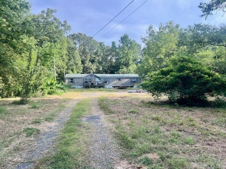 Great investment opportunity! 4 bed, 2 bath mobile home on 1 Acre. This is  a fixer upper.  There is a slab in back that is perfect to build a shop. Being sold AS-IS.