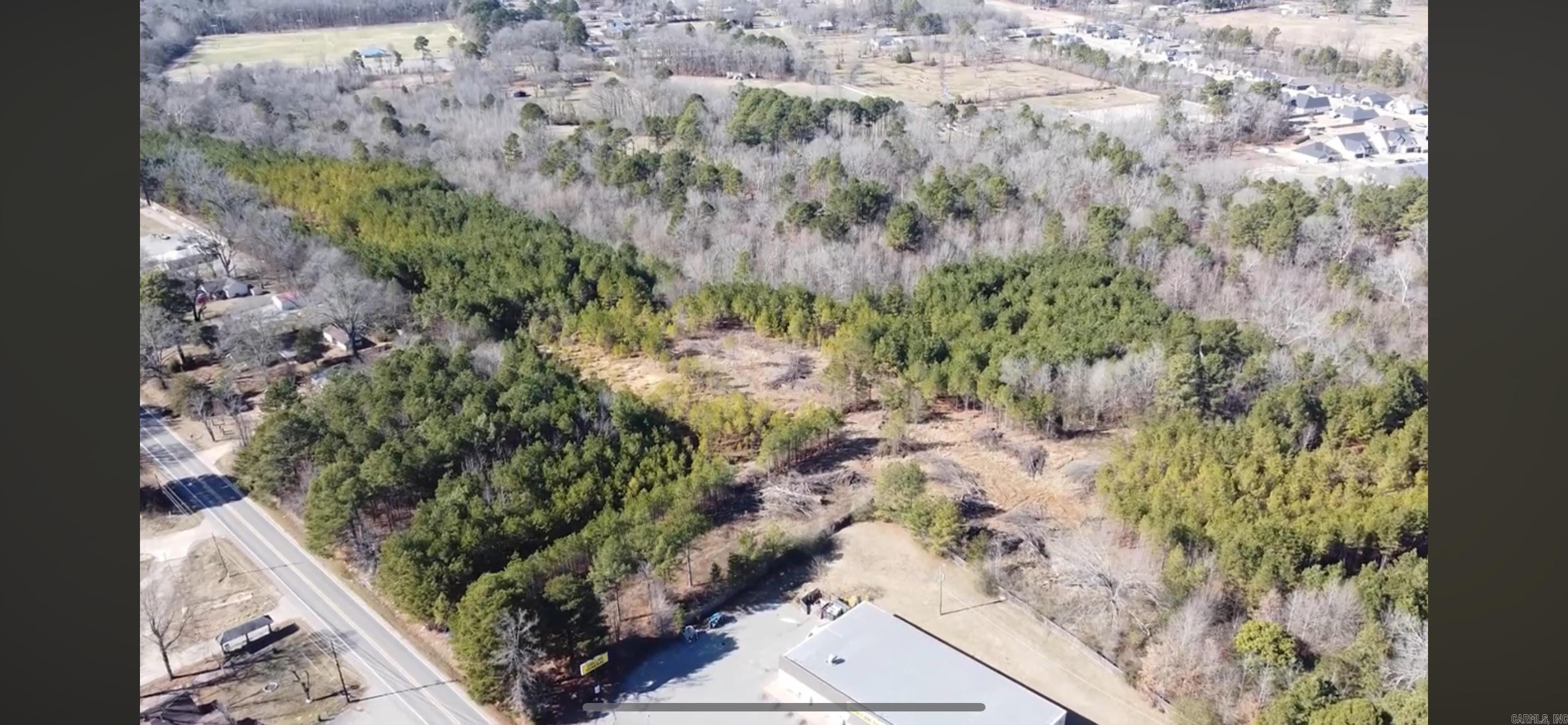 Multi-family zoned property ideally located inside Bryant City Limits next to Dollar General. Property beside and behind Dollar General. Great potential!