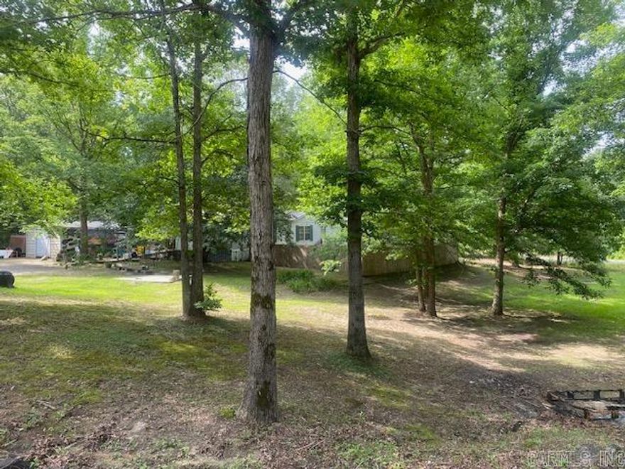 Cute mobile home in Bryant School District !  Sits on almost one acre...has two sheds and also an apartment in back. Very nice sized kitchen and great room, three bedrooms and an office (could be used for 4th BR). AGENTS SEE REMARKS