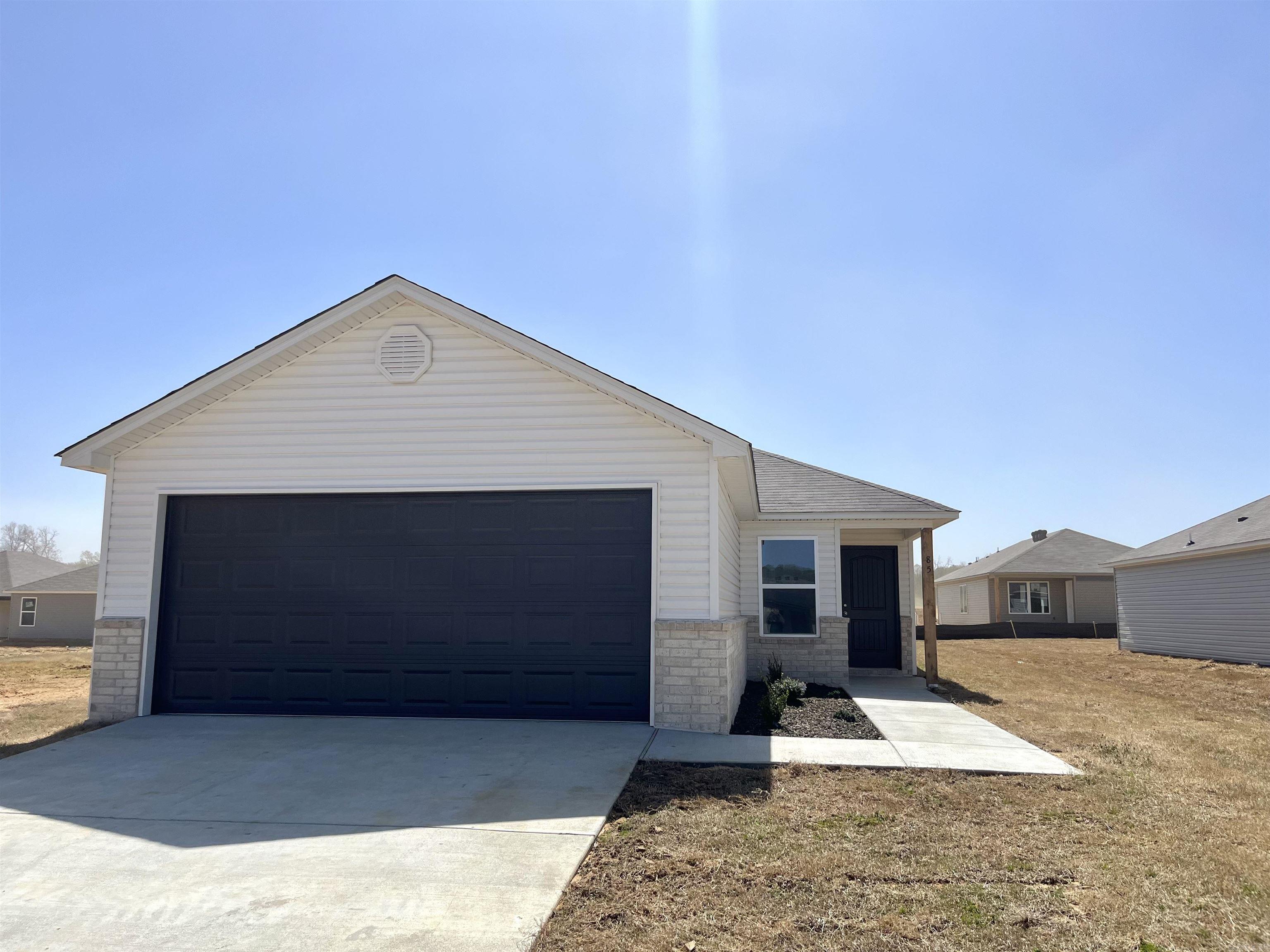 The Cooper plan is a sweet plan that uses every square foot of space efficiently! Come tour it today. Valuable upgrades included: 14'x7' uncovered patio, soaker tub/shower combo in Master Bath, plumbing faucet upgrade 2, 8" deep Kitchen sink, 16" laminate bar top in Kitchen, Luxury Vinyl Plank flooring in wet areas and Living Room and adjacent hallways, garage door opener 1, raised ceilings in Living Areas per municipal requirements, fiberglass exterior doors, Cheyenne style doors, baseboards level 2, 25in wide attic stairs, LED disk in Kitchen, full sod, stainless steel appliance package. ***AGENTS: PLEASE SEE AGENT REMARKS AND/OR SHOWING REMARKS FOR VERY IMPORTANT INFORMATION.*** THIS HOME IS SCHEDULED TO BE COMPLETE IN MARCH 2025. PLEASE NOTE: The mailing address for this property is Cabot. The city that governs this neighborhood is Ward. The community is located in the Cabot School District.