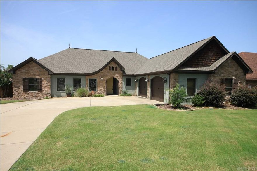 Must see beautiful home in Bryant school district. Gorgeous rock columns divide open space between dining/living areas. Quartz countertops, gas stove, stainless appliances, and pantry in kitchen.  Extra lg. laundry rm. with craft area. Master BR with tray ceiling and French doors to private covered patio. Nice master bath with large walk-in closet. Fully fenced backyard on flat lot. Stone and brick front has great curb appeal. Oversized garage with mud room as you enter from the garage. See agent remarks.