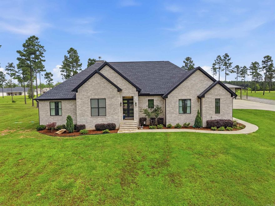 This exceptional 3-year-old custom-built home is packed with upgrades, character, and thoughtful details throughout. From the moment you step inside, you'll appreciate the craftsmanship and custom touches that make this property stand out. The open living area features a stunning vaulted ceiling and a site-built wood-burning fireplace. The kitchen was designed with both style and function in mind, offering a gorgeous waterfall island, custom finishes, double oven, and a spacious walk-in pantry. The split floor plan creates the perfect balance of openness and privacy. Tucked away from the secondary bedrooms, the primary suite offers a relaxing retreat with a spacious bath and separate his-and-her walk-in closets. Enjoy peaceful mornings and relaxing evenings on the covered back porch, complete with its own vaulted tongue-and-groove ceiling. Outside, the 3-acre property provides plenty of room to spread out and includes a shop with electricity, ideal for projects, equipment storage, or recreational use. This property checks all the boxes!