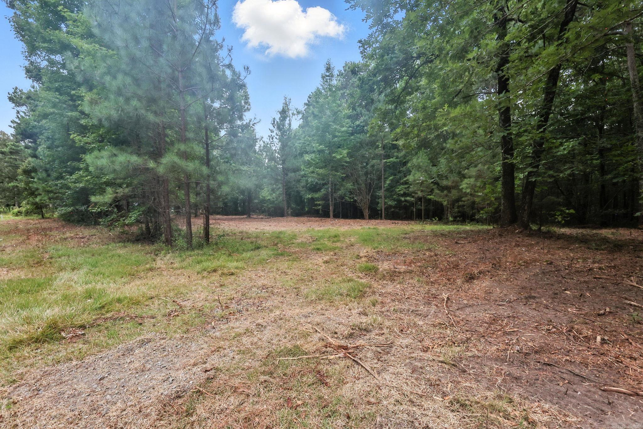 Endless possibilities await on this beautiful 6.86-acre property just outside the city limits! With no restrictions, this land is ready for your visionāwhether you're planning a mobile home, tiny home, or a custom-built dream home, the choice is yours. The property already features a well and septic system, saving you time and money. Enjoy the peace of rural living with the convenience of being close to town. Bring your animals, your building plans, or your investment ideasāthis is a rare find with utilities in place and total freedom to create what you want.