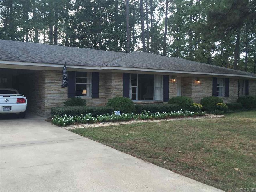 Absolutely immaculate! Ready to move into 3 bedroom, 2.5 bath stone house on 1.88 acres. Fully fenced back yard with a shop and beautiful landscaping.