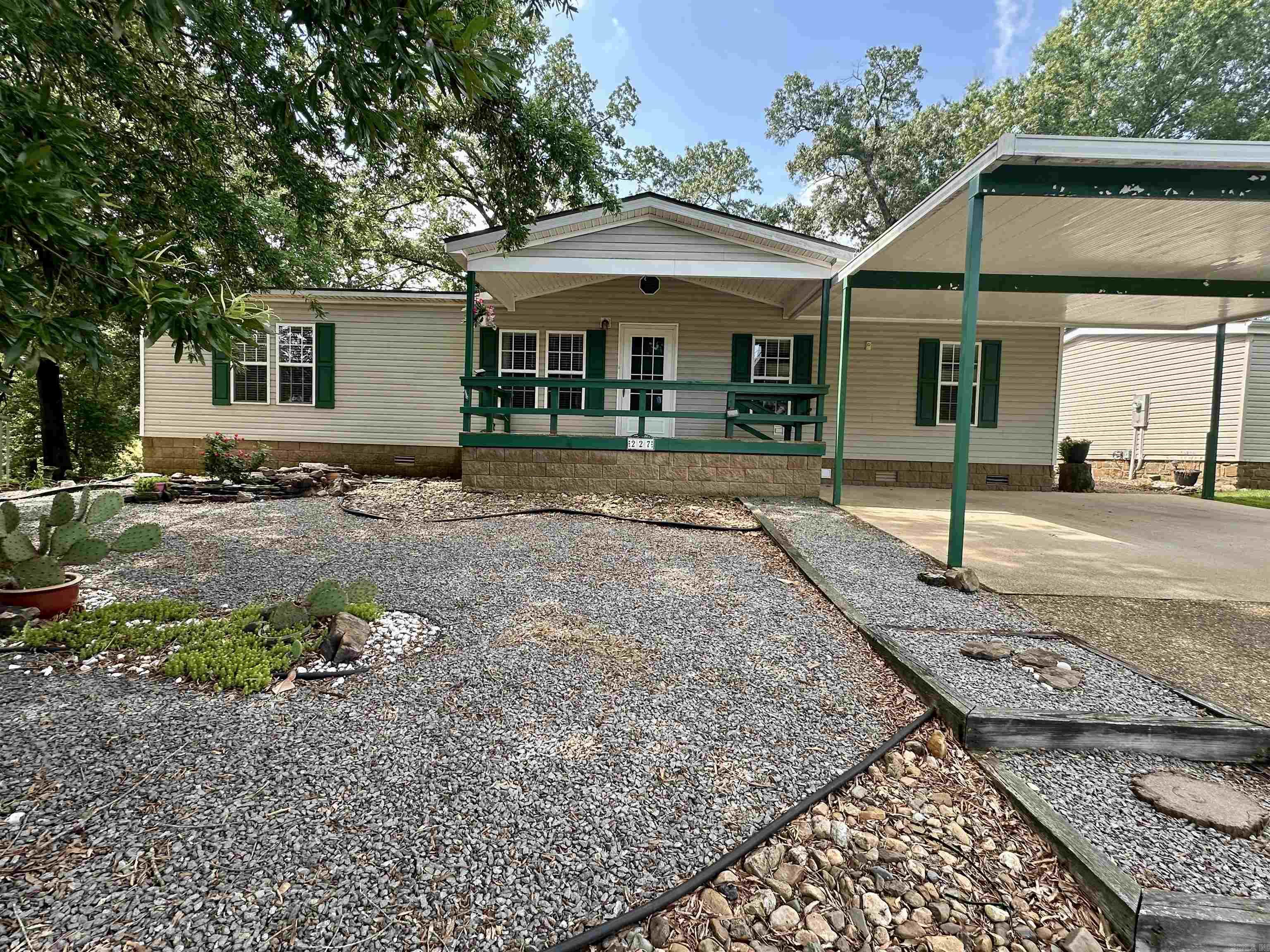 This spacious, bright home with too many updates to list is located in a wonderful 55+ community with super low POA dues but lots of amenities for your entertainment! The home features a covered front porch, side porch and a 434 sq. ft., fully screened back deck with ramp covered in durable Chattahoochee river rock. Permanent foundation, with 2X6 exterior walls. Updates include: paint, AC unit, heat pump, 2024 roof, 2024 water softener, mini split in master, gas fireplace with extension available for master bedroom, stainless refrigerator and newer stove, basin in laundry room, LVP flooring, exterior doors, wood blinds and more. Master includes its own mini-split heat/air unit. Plenty of room for entertaining in the amazing eat-in kitchen with lots of storage and cabinet space. Furnishings can convey. Simplisafe security system.