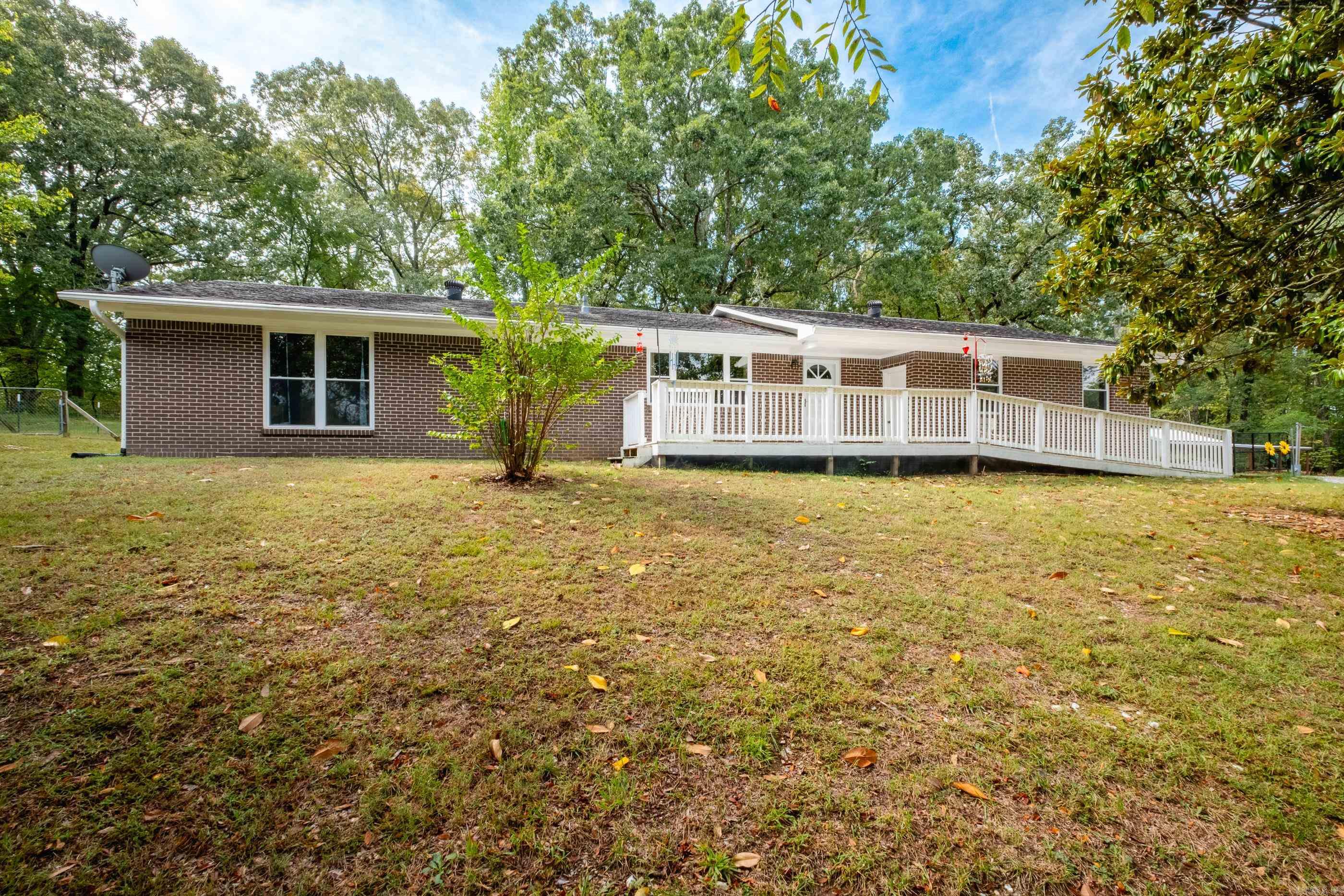 One story brick home on almost 4 acres with a huge shop. Whole house generator runs on propane; windows replaced 2018; HVAC and water heater 2019; 2 car garage. Granite counter tops and tile backsplash in kitchen. Large living area and laundry; primary bedroom with private bath and two closets. USDA eligible and possible assumable VA loan with a 2.75% interest rate for qualified buyers. See agent remarks.