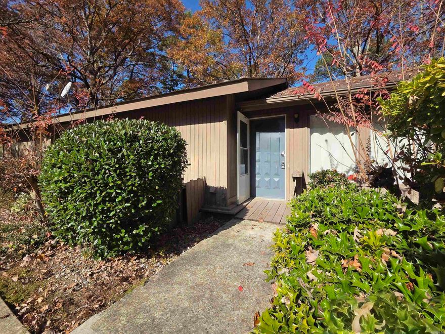 Welcome to this beautifully updated and furnished 2-bedroom, 1.5-bath condo just minutes from the West Gate. This move-in-ready home features stylish finishes with no carpet, a well-appointed kitchen, and a washer, dryer, and refrigerator that all convey. One bedroom offers direct access to the large back deck, perfect for relaxing or entertaining. Enjoy all the wonderful amenities of Hot Springs Village, including golf courses, lakes, and scenic surroundings. This charming condo is ideal as a full-time home, vacation getaway, or investment opportunity.