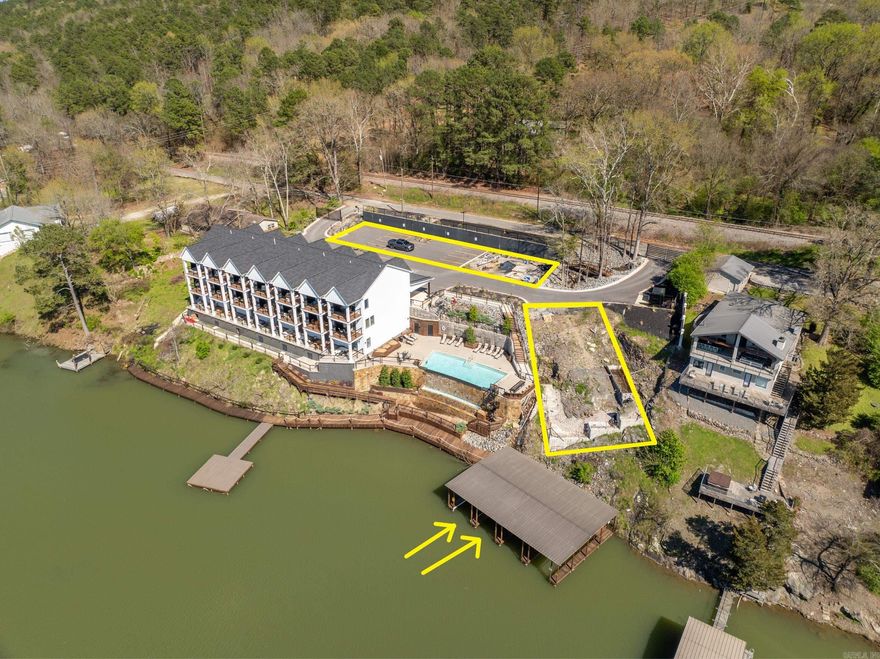 231 Ledgerock / LAKE HAMILTON WATERFRONT and   water view development lots (11) total lots - include (2) covered boat docks - the BEST buy on Lake Hamilton development property! The (2) covered boat docks alone are worth $150,000!  PLUS over 200' of boardwalk & pier docking. ALL SITES ARE APPROVED FOR NIGHTLY RENTALS AND DO NOT FALL UNDER THE CITY'S LIMIT (2) Waterfront lots are immediately adjacent to the infinity pool w/ 40" waterfall and cozy fire-pit. overlooking the lake. It is possible to build only 1 unit on this site. (3) Lakeview lots overlook the pool and the lake - located adjacent to the arched bridge and the waterfall (fed from the lake sprinkler pump), (6) remaining lots are currently used for overflow parking.  These lots are platted development lots or could be leased to the current owners With a putt-putt golf course, go cart track, bumper boats, kid's arcade, Domino's pizza and huge liquor store less than two blocks away this is by-far the best nightly rental site in Hot Springs.  PLUS Oaklawn Racetrack and Casino, Northwoods Bike Trails and downtown Hot Springs are 10 minutes away!  Agent has ownership interest.