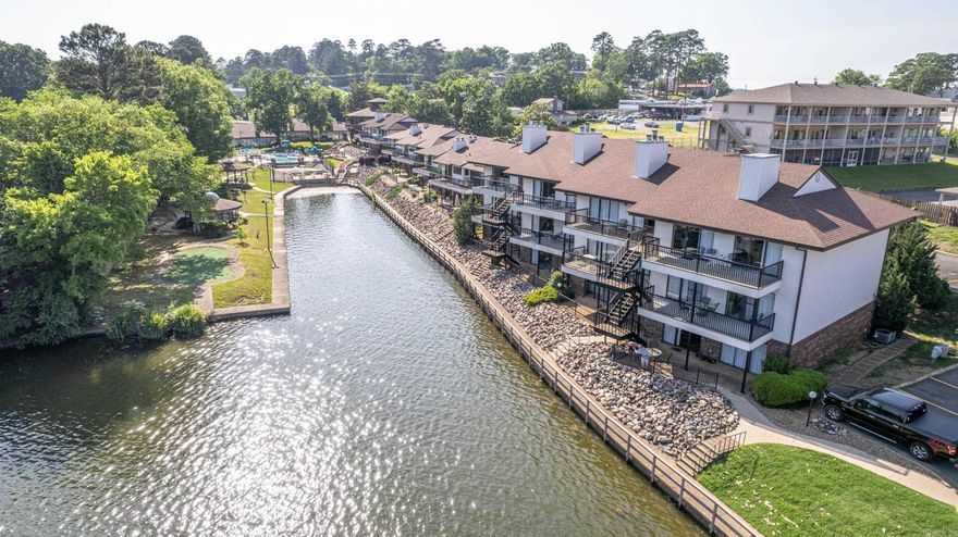 What is 5 minutes from Oaklawn, 7 minutes to downtown Hot Springs & sitting on the beautiful Lake Hamilton? THIS, fully updated & comes TURN KEY READY furnished condo in the highly sought-after 7 south area RIGHT off of Central Avenue. With the convenience of all of the restaurants & shops within minutes away but nestled inside a gated getaway on the lake. The Emerald Isle Condominiums come stacked with amenities including an amazing lake side swimming pool, pickleball courts, and YOUR VERY OWN BOAT SLIP!!! swimming area, bbq cooking area, gazebo & so much more. While you're not outside enjoying all that this amazing property has to offer outside you can cozy up inside. Two spacious bedrooms & bathrooms, large living room, kitchen and dining area for entertaining & creating memories. This one has it all! Investors, take notice! This is a moneymaker! Call for a private showing, today