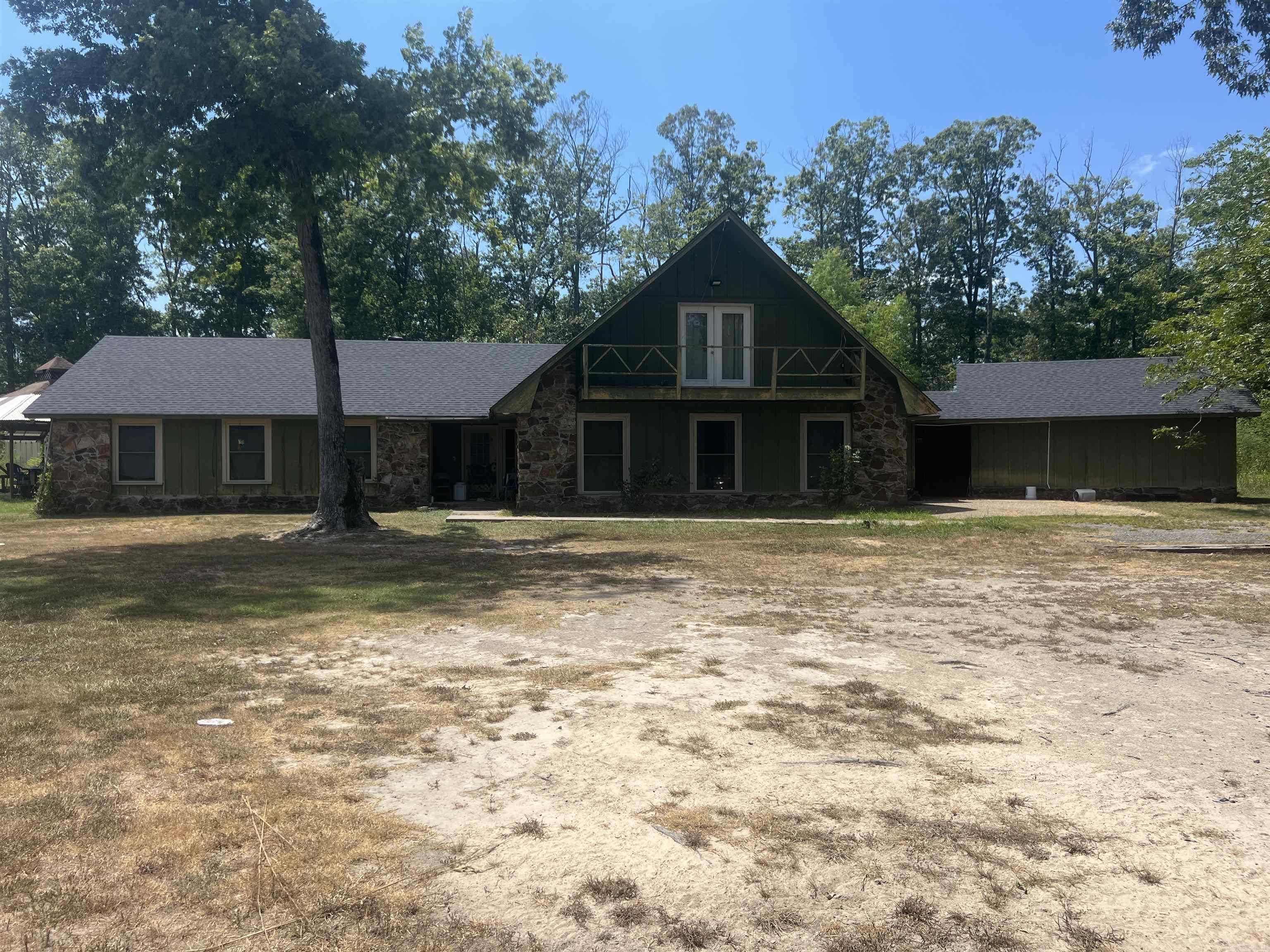 Great investment opportunity sitting on 7.2 acres. This home has a pond in front, two outbuildings, one with a car lift, a large gazebo, a newer roof and a new whole house generator. Remodeling has been started and a garden tub and vanity will convey.