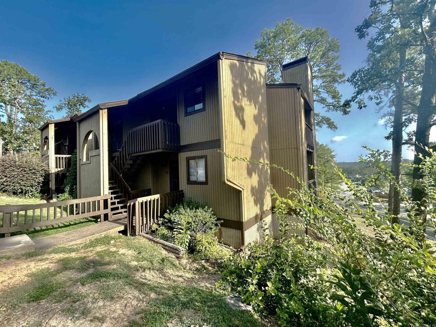 Would you like to sit on one of the two balconies and sip your java in the morning or unwind in the evening to view the skylights of Little Rock?  This upstairs condo offers beautiful scenic views from the living room and primary suite.  Do not worry about buying appliances.  This condo comes equipped with it all from newer flat surface stove, stainless steel dishwasher, SS refrigerator, washer, dryer and refrigerator to convey. ITS HOT so you can take a dip in the condo pool as a plus for living here. To be sold "AS-IS" Condo monthly dues are set for an increase in October to reflect a total of $350