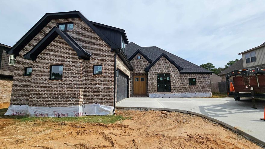 This European style home with a modern flair offers a wide open floor plan perfect for entertaining. This open space features both a formal dining space and dining space in the kitchen area along with an island/breakfast bar. Raised ceilings, gas log fireplace, rich stained cabinetry and exquisite quartz counter tops offer a great first impression to this 4 bedroom and 3 bath home.