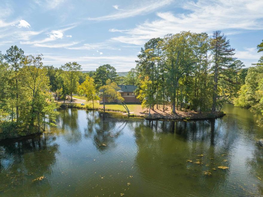 Welcome to your private oasis on a 2.8-acre peninsula, boasting an impressive 1700 feet of pristine lake frontage! This exquisite property offers the perfect blend of rustic charm and modern luxury.  Nestled amidst nature's beauty, the primary residence is a custom-built 3-bedroom, 2-bathroom masterpiece. Crafted with a keen eye for detail, it exudes rustic character. The spacious living area features a stone fireplace and panoramic windows that frame stunning lake views. The chef's kitchen is well-appointed with top-of-the-line appliances and a large island.  Two 1-bedroom, 1-bathroom cabins offer guests a cozy retreat. Perfectly situated for privacy, they provide an ideal spot for extended family or rental income potential.  Outside, enjoy endless activities from your own backyard. Fish, swim, or kayak from your private dock. Explore the surrounding woods, or simply unwind on the sprawling deck overlooking the serene waters. The enchanting sunsets will leave you in awe.  This unique property combines the serenity of lake living or the potential for instant cash-flow through an already successful and profitable VRBO business! VRBO Financials available on request.