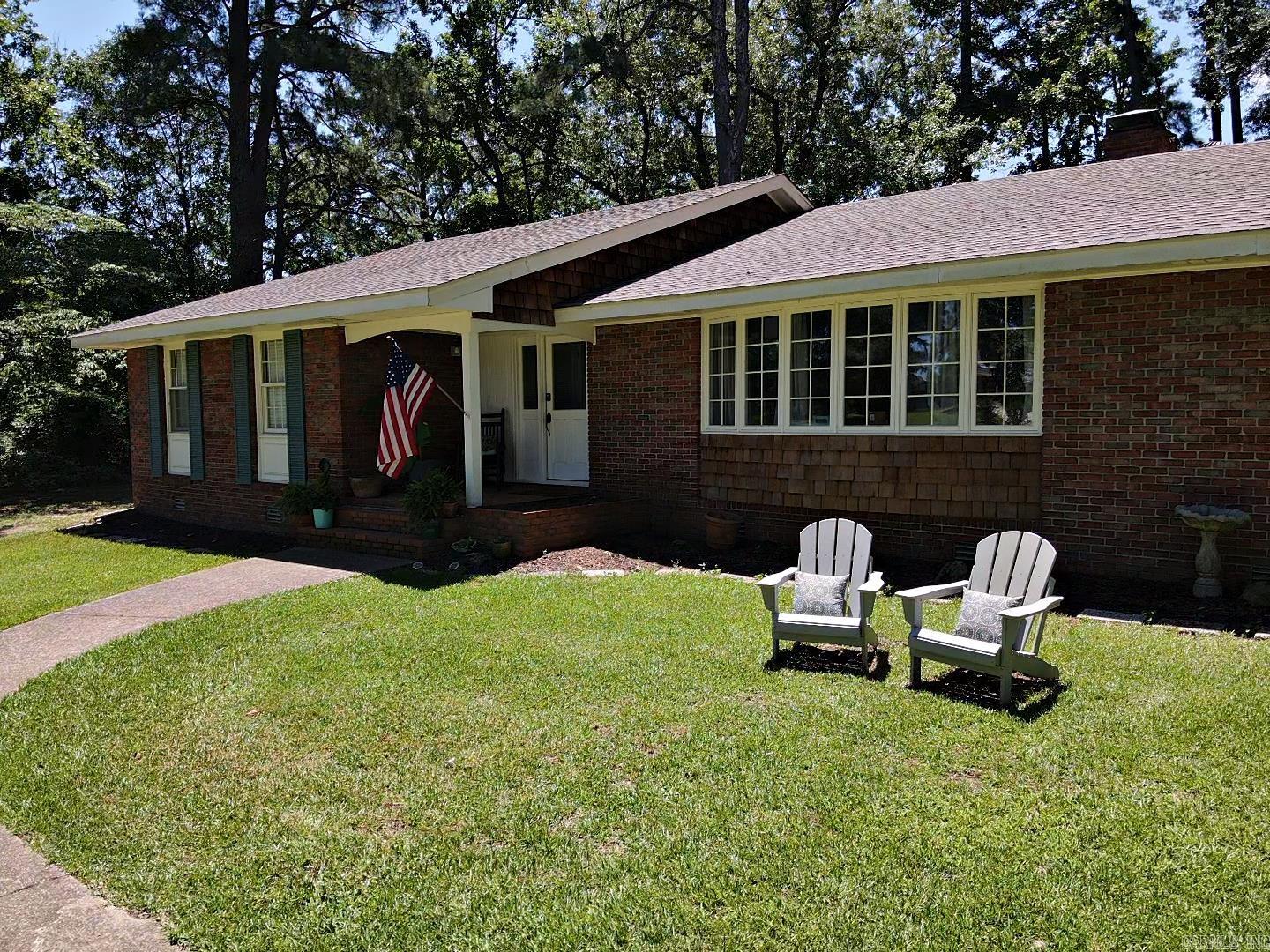 Spacious home nestled on large wooded city lot. This 4 bedroom 3 bath home with formal living room and comfortable family den with wood burning fireplace is a must see. Packed with fresh renovations like new paint, wallpaper and scraped ceilings, lighting, ceiling fans and smoke alarms, security cameras, flooring, water heater, guest bathroom; these are just some of the interior upgrades. Painted shutters, tree removal, privacy fence, garage door, HVAC and new roof round out exterior renovations.