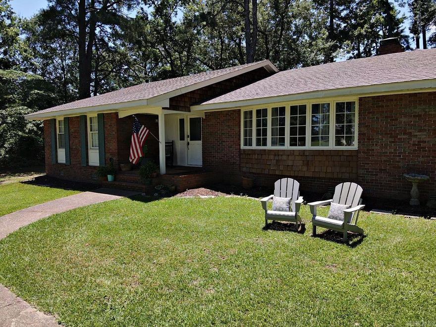 Spacious home nestled on large wooded city lot.  This 4 bedroom 3 bath home with formal living room and comfortable family den with wood burning fireplace is a must see.  Packed with fresh renovations like new paint, wallpaper and scraped ceilings, lighting, ceiling fans and smoke alarms, security cameras, flooring, water heater, guest bathroom; these are just some of  the interior upgrades.  Painted shutters, tree removal, privacy fence, garage door, HVAC and new roof round out exterior renovations.