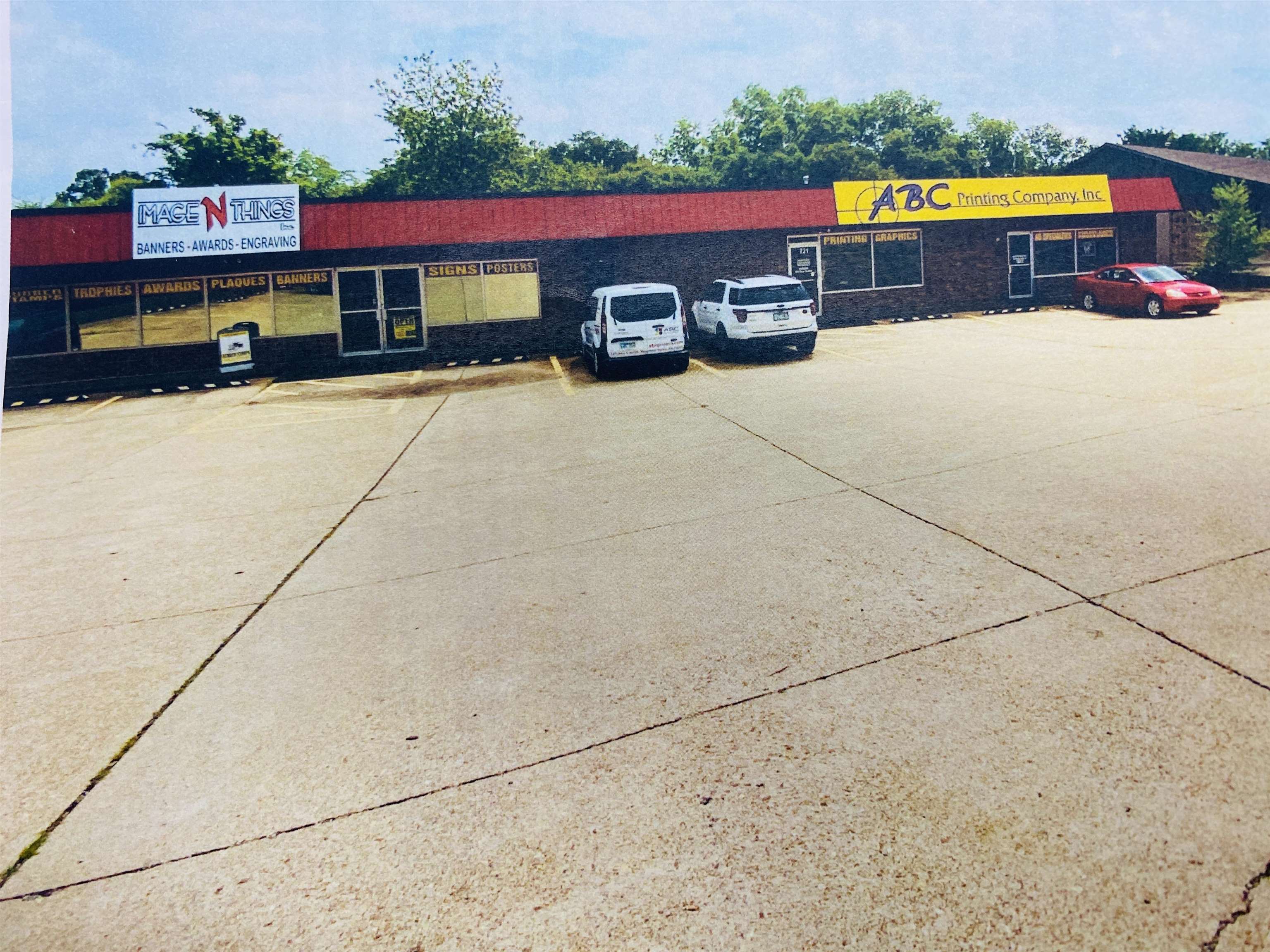 This excellent commercial opportunity features two side-by-side buildings situated on a total of 0.60 acres in a high-visibility location along the highway in Mountain Home, Arkansas. Combined, the buildings offer approximately 9,296 square feet of space—one building with 5,296 sq ft and the other with 4,000 sq ft. Each building includes a mix of office space and open floor area, making them highly adaptable to a variety of business needs. Both buildings could easily be divided and customized for multiple uses. One building features a small loading dock that leads into a work or storage area, while the other offers convenient rear parking. This is a fantastic opportunity to own a flexible commercial space in a strong business area. Priced at $845,000.