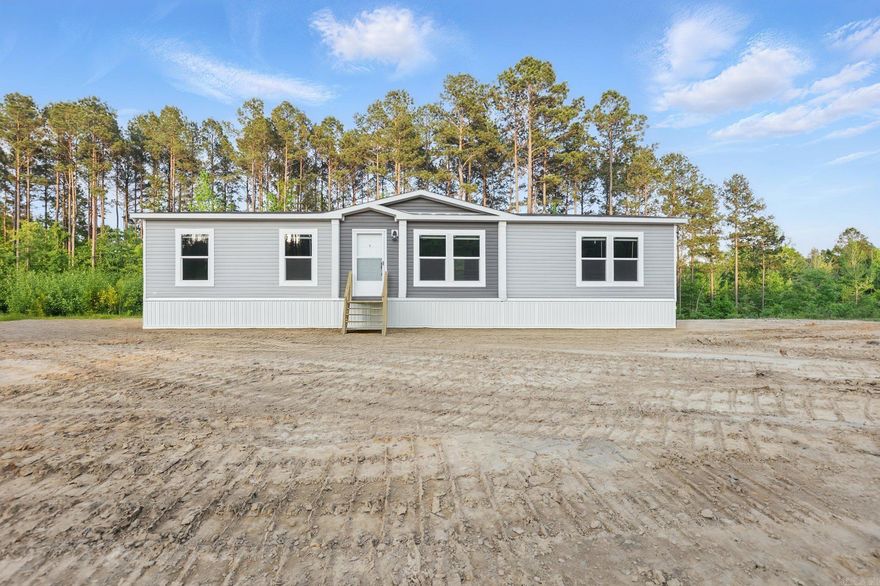 BRAND NEW Mobile home on permanent foundation ready for its new owner. This beautiful homes sits on over an acre of land. 3 Bedrooms (split bedroom plan) and 2 full bath rooms. The primary suite has plenty of space with a bathroom including a separate shower and large soak tub for those bath lovers. The family room space is fabulous with an open living room, kitchen and dining area. Everyone will always be included at gatherings and daily family time with all this open space. There is a nice laundry room off the kitchen. The hallway leads you into the bonus area that could be used as a secondary living space, office, etc. At this end of the home there are two additional bedrooms and a full bathroom. This is an excellent opportunity to own a new home and have some acreage. This property is located in the East End Community (Sheridan School District). You will not want to miss out on this!!  AGENTS SEE REMARKS FOR OFFERS