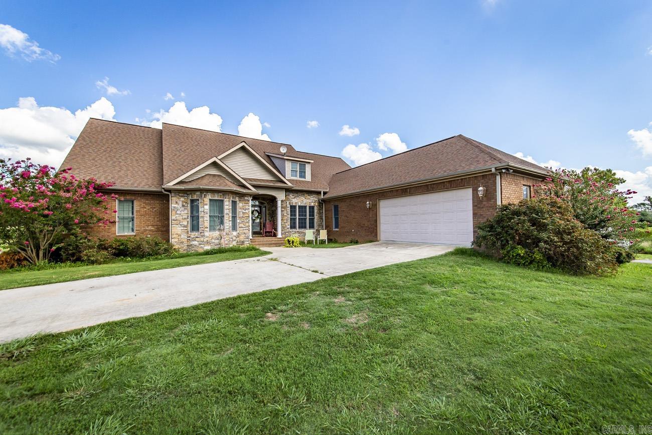 Enjoy the feeling of Country Living but only 3 miles to town and roughly 5 minutes from boat launches and Marinas in Greers Ferry. This spacious 5 bedrooms, 4 full baths, 2 bonus/office rooms, as well as, an extra living room/game room upstairs, a safe room and so much more, all sitting on roughly 7.5 acres M/L. There is a large concrete pad for an RV with electric/ water hook-ups and family farm cottage on the property. This home is perfect for a weekend getaway for large family or a couple of families to share and even a vacation rental. For those wanting to escape City Life and have a full time small farm homestead take a total property tour. Schedule your appointment today and start Living Lake Life. Agents please see remarks.