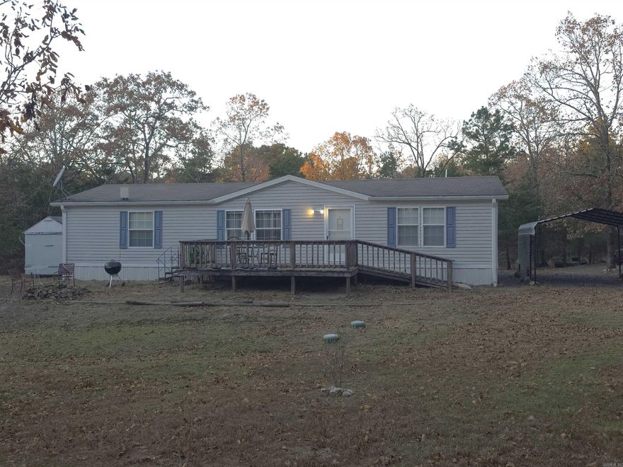 Short distance to bike trails and Ouachita National Forest. Neat home on 5 acres, 3 bedroom 2 bath home with deck, chicken coop, fenced garden area, outside storage buildings and room to roam! Inside is open concept, separate primary bedroom & bath, new carpet and new havc thermostat. Each bedroom has a walk-in closet. Kitchen has center island with sink and breakfast bar. Washer and Dryer stay, as does the refrigerator and big screen TV!! This place is neat & clean, and is priced to sell! You can move in the day you close!