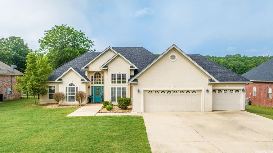 Wonderful 3/2 home setting on the back 9! This stucco home is just what you're looking for! Tall ceilings, new paint & 3 car garage. This split floor-plan home has a large master bedroom that features a sitting area big enough for a small office space. The master bathroom features his & hers vanities, large center tub, & shower. Kitchen/Breakfast combo & separate formal dining area. Fireplace in living area. Then step outside to your covered back patio that features a first class view of the back 9!