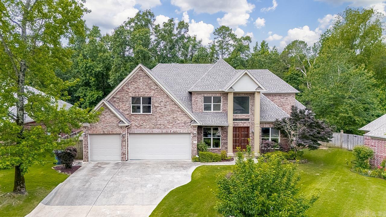 This custom-built home in Chenal Valley is located in a quiet cul-de-sac and backs up to green space on a level lot. The open floor plan features the master suite on the main level and an impressive kitchen with a vaulted ceiling, granite countertops, custom cabinetry, and a large walk-in pantry with a wrap-around breakfast bar. Upstairs, you'll find a guest suite with a fabulous attached bath, another spacious bedroom with a large walk-in closet, and a sizable game room that could easily serve as a fourth bedroom. There is a full bath conveniently accessible for these rooms. The home also includes a 3-car garage with built-in storage.Recent updates include a new roof in 2024, a dishwasher in 2023, an oven in 2024, a microwave in 2024, all-new interior paint in 2025, and new carpet upstairs in 2025.dishwasher 2023, oven 2024, microwave 2024, all-new interior paint 2025, and upstairs carpet 2025.
