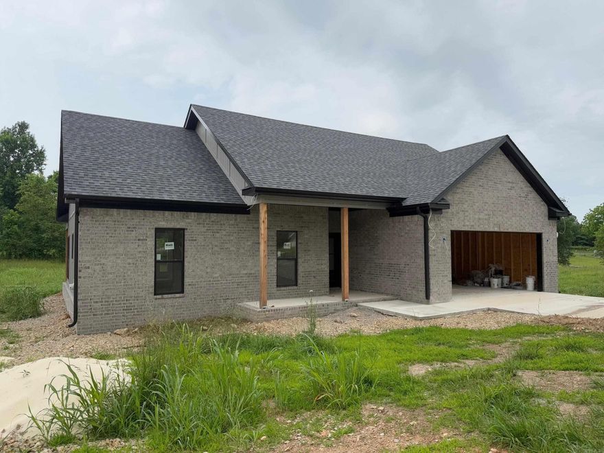 Tucked into Country Meadows Subdivision, sits this new home construction.  The Great Room, complete with a fireplace, is the central gathering place of your home and opens to the Dining Room, tucked into a charming alcove. An eat-at peninsula joins these spaces with the Kitchen/Breakfast Room combo, and tons of counter space, granite countertops and storage in the spacious Kitchen allows you to prepare anything your guests desire. Complete with sliding door access to the Great Room and Breakfast Room is a rear Grilling Porch just right for summer barbecues. A convenient computer nook just off the kitchen allows you to monitor the children’s activity while working from home. Down the hall are Bedrooms 2 and 3, as well as a hall bath to the left. Bedroom 3 may also be used as a study, if desired. The other side holds the Master Suite, where the large master bedroom lies below a 9-foot boxed ceiling. The Master Bath is perfect for relaxing the day away, with luxuries of a garden tub, separate shower, and his and her walk-in closets. Just down the hall from this suite is the laundry room, allowing for quick transport on laundry day. Fifteen minutes from Crown Lake.