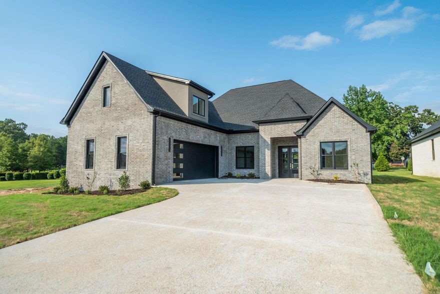 Experience refined living in this exceptional 4-bedroom, 3-bathroom, 3,100 sq. ft. residence located in the highly coveted Arlington Park Subdivision. Thoughtfully designed with modern elegance and functionality in mind, this brand-new construction offers an open-concept floor plan that seamlessly blends spacious living areas with high-end designer finishes throughout. The gourmet kitchen is a chef’s dream, complete with custom cabinetry, top-tier appliances, and an expansive layout ideal for both casual meals and entertaining. A luxurious primary suite serves as a private retreat, featuring a spa-inspired ensuite with premium fixtures, a soaking tub, and generous storage. Each bathroom throughout the home is beautifully appointed with upscale materials and stylish design. A versatile bonus space provides the perfect setting for a playroom, media room, or secondary lounge area. Step outside to the covered patio with a cozy fireplace—an inviting extension of the living space, perfect for year-round outdoor entertaining. Custom touches and architectural details add warmth and sophistication to every corner of this remarkable home.
