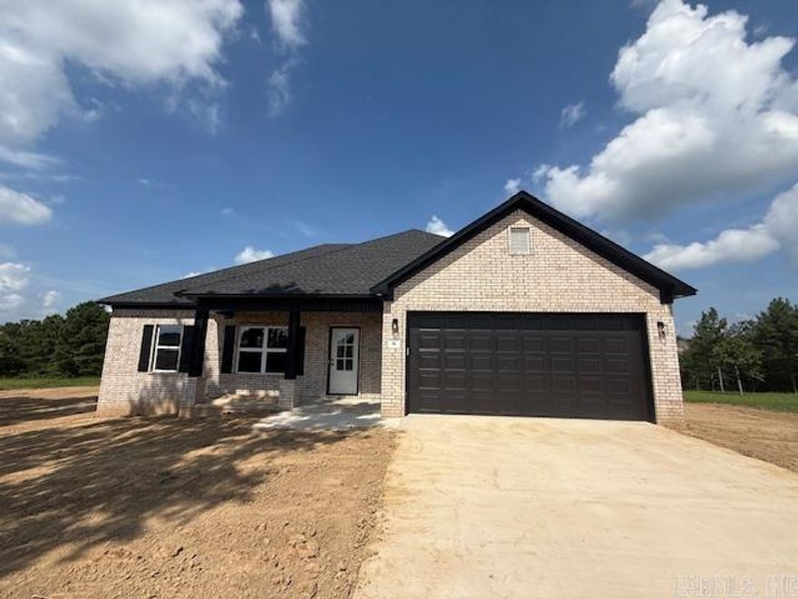 Looking for a new home on a large lot. This is it! Enjoy the view from your back porch. You will likely see a few deer. Large living room open to the kitchen. Nice sized island in the kitchen with cabinetry in the island. Guest rooms are separate from the primary bedroom. Has a nice yard with trees. The backyard is private with woods behind the home.