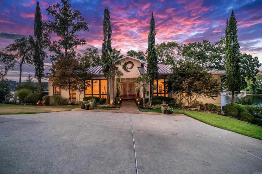 Must see one of the most coveted lake homes on all of Lake Hamilton. This iconic lake front property includes 5 Bedrooms, 5.5Bathrooms, over 5,600 square feet and sits on over 254' of Lake Hamilton. The exterior boast some of the best views on Lake Hamilton, and includes a beautiful gunite pool, outdoor kitchen, and multiple entertaining areas. The interior includes all high end finishes, main level primary with a private terrace, two living areas, large open concept kitchen/dining/living, and much more. The interior was also recently updated to include a theatre room, game room, and additional bunk beds.  Call today to see this iconic lakefront home on Lake Hamilton!