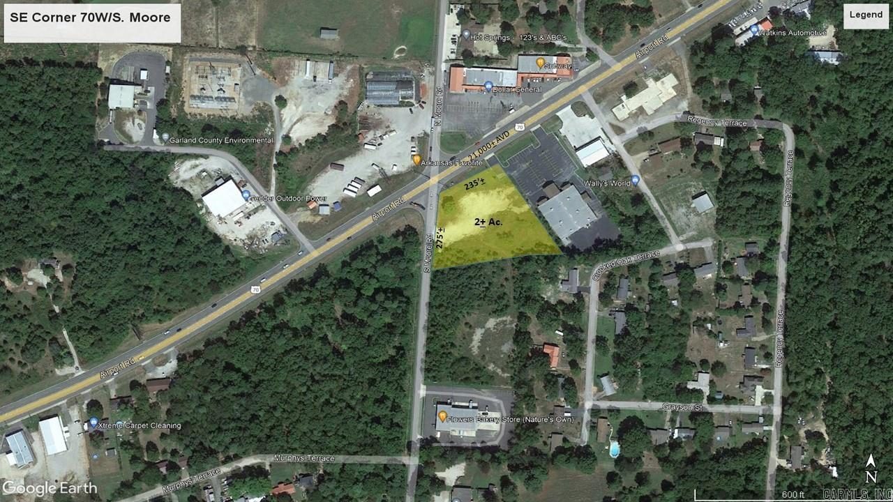 2 acres at prime commercial corner with 200+ frontage on busy Hwy 70W (21,000+/- cpd) at stoplight intersection. Level lot with access on two sides in an area of commercial growth. All city Hot Springs utilities available, additional 3+/- adjacent acres available. Billboard lease does not convey.