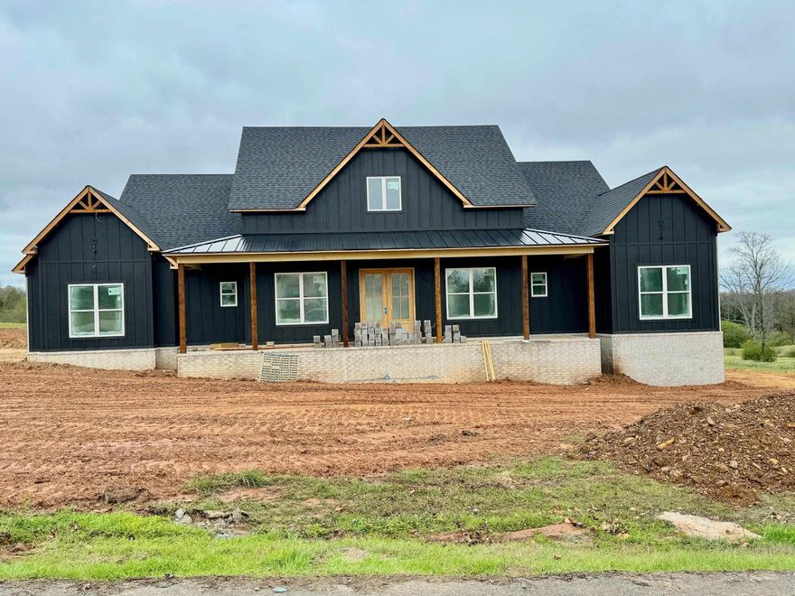 GORGEOUS NEW CONSTRUCTION !!! 4 bedrooms, 3.5 baths, office, 2400 sq ft, FP, LVP flooring, Kitchen Island, Floating shelves, Separate dining area with cross beams, Laundry with sink & cabinets, Pantry, Jack n Jill bathroom, Primary bathroom has tiled walk in shower & a tub, Primary closet has builtins, tankless hot water heater, Cooktop with wall oven & microwave, Brick home with pretty Hardy Board 3 car side loading garage, HUGE front & back porch, 1 load of sod, all on 2.17 acres. taxes are est only on lot. Plans & specs are est only, subject to change. See interior photos for examples of the interior. This home is going to be FABULOUS !!!!!