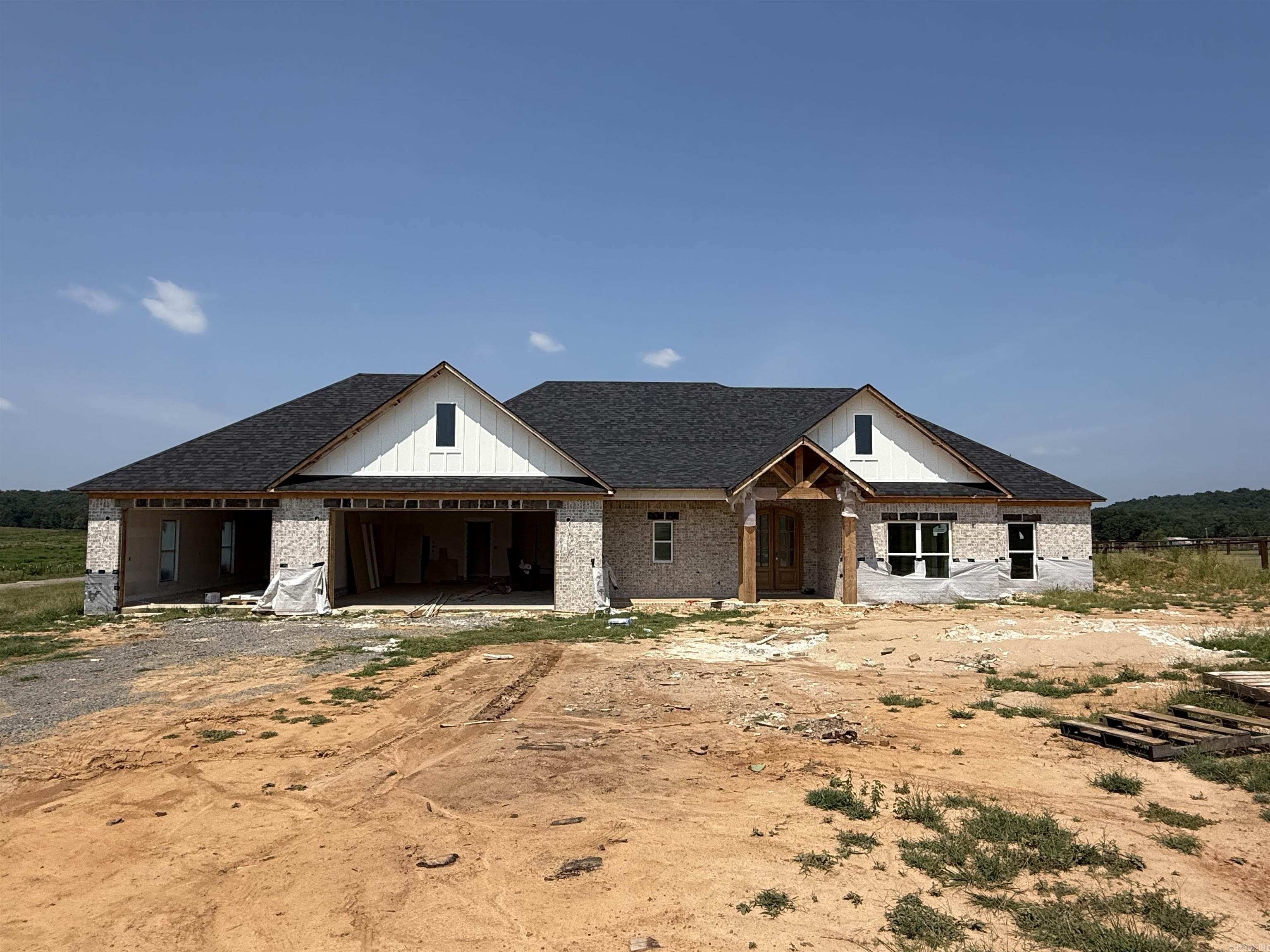 This floor plan is perfect. 4th bedroom is at the front of the house and would also make a great office. Vaulted ceiling in the living room with a wood beam. Electric fireplace with brick and shiplap. Kitchen has all the extras, huge hidden pantry, lots of storage with drawers for spices and utensils. Large laundry with a sink and walks through to the master closet. Separate tile shower with soaking tub. 1/2 bath as you enter from the garage. No carpet. Jack and Jill bathrooms between the spare bedrooms with a door to the hallway as well. All of this on an acre lot. Don't forget the large back porch with vaulted wood ceiling. Wood under the front porch ceiling as well. High speed fiber internet available!