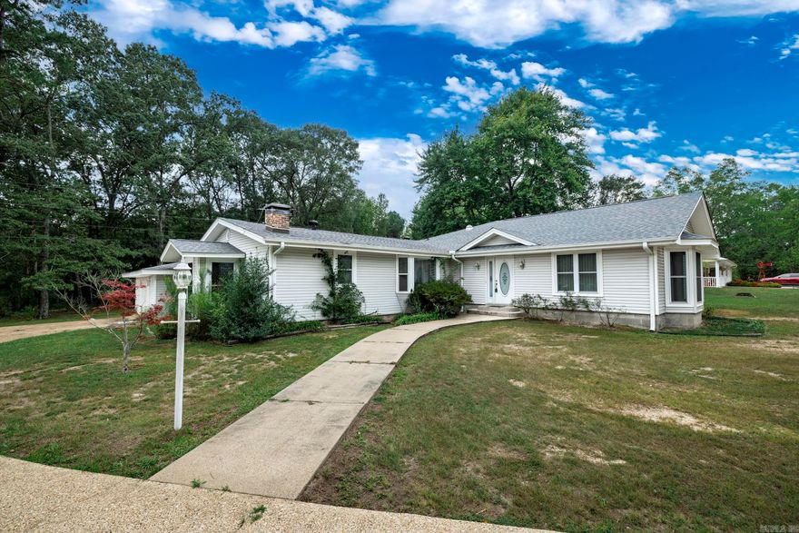 This three-bedroom, three-bath home with a bonus room and den sits on just over an acre right outside of Arkadelphia, offering plenty of space and flexibility. The main house features a newer roof, two newer HVAC units, and a practical layout with two bedrooms and two bathrooms. The front bedroom includes a bonus area and kitchenette, making it an ideal setup for a mother-in-law’s suite or guest quarters. Additional highlights include a cozy den, a small back deck with newer boards perfect for relaxing outdoors, and a two-car garage for parking and storage. This property provides the perfect blend of country living with convenience to town.