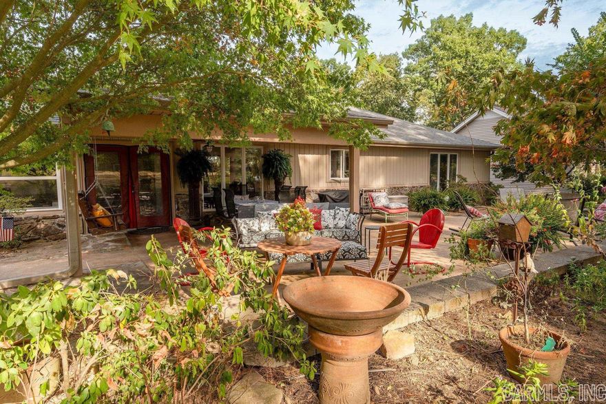 One-level open floor plan on Indian Hills Golf Course. Just minutes to Greers Ferry Lake, 40,000 acre lake in the top 5 cleanest in the US. Gorgeous spacious kitchen with storage. Beautiful outdoor entertaining area with a water feature/fish pond & gardens. Spacious bedrooms. Come enjoy sitting on the patio watching the golfers & listening to the fish pond.  Raised vegetable gardens & gardening shed. The landscaping is beautiful w/the ornamental trees.  Great covered patio area to enjoy eating outdoors.