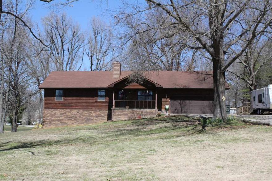 This is a great home situated on over one acre of beautiful land. Open family room features a vaulted ceiling, cozy fireplace & wood floors. The updated eat-in kitchen boasts hickory cabinets, formica counters, a buffet area & stainless steel appliances. The spacious master bedroom has a walk-in closet & en-suite bath. Screened-in porch overlooks a fenced area for small children or pets to play. Other amenities include a laundry room with utility sink, a walkout basement, a two car garage & covered porch.